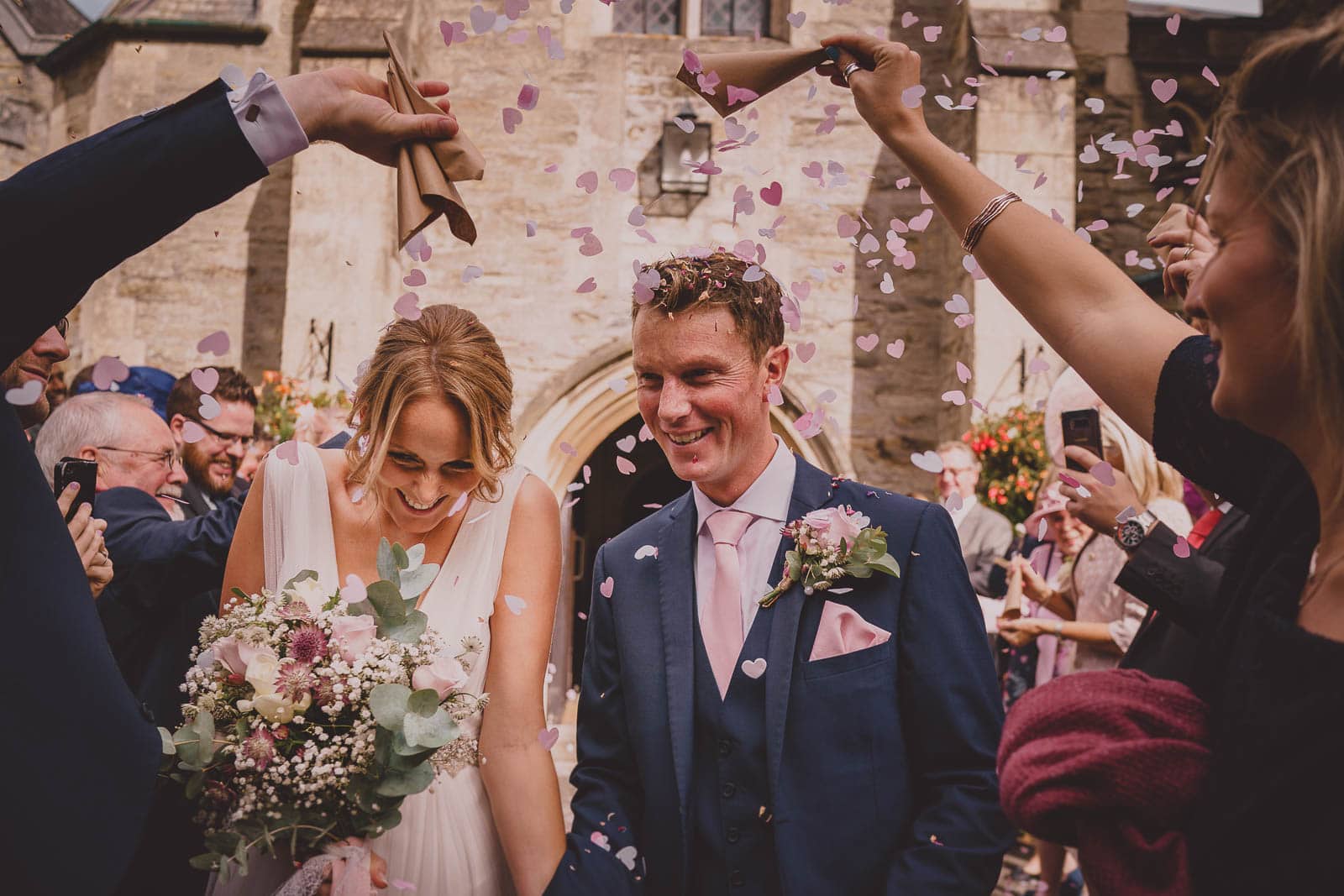 An image of wedding confetti being thrown at Alverton Manor.
